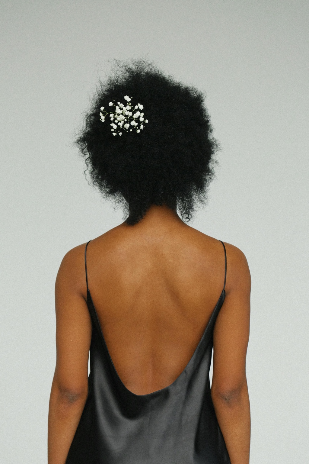 Woman with natural hair and flowers